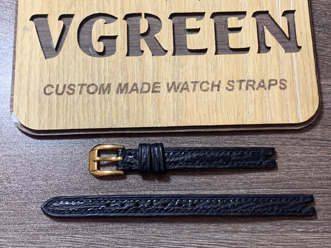 Black sharkskin watch strap for vintage Gucci 2000L, center-notched with gold buckle