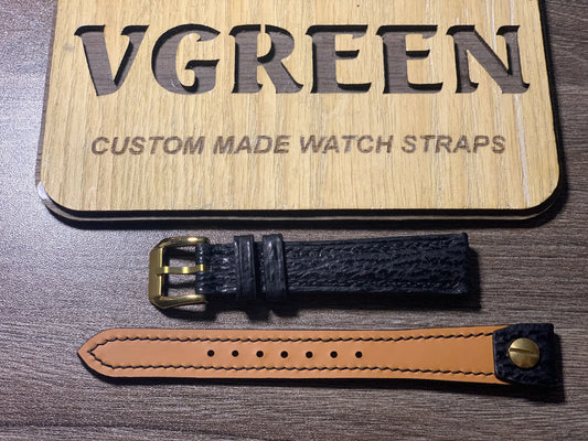 Black sharkskin open-ended watch strap for a vintage gold Omega, 17mm fixed-lug fitment