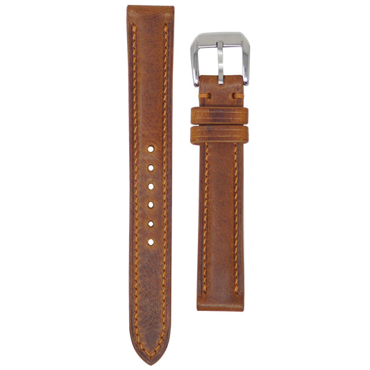 Cognac Badalassi Wax leather watch strap with matching stitching and silver buckle, flat lay.
