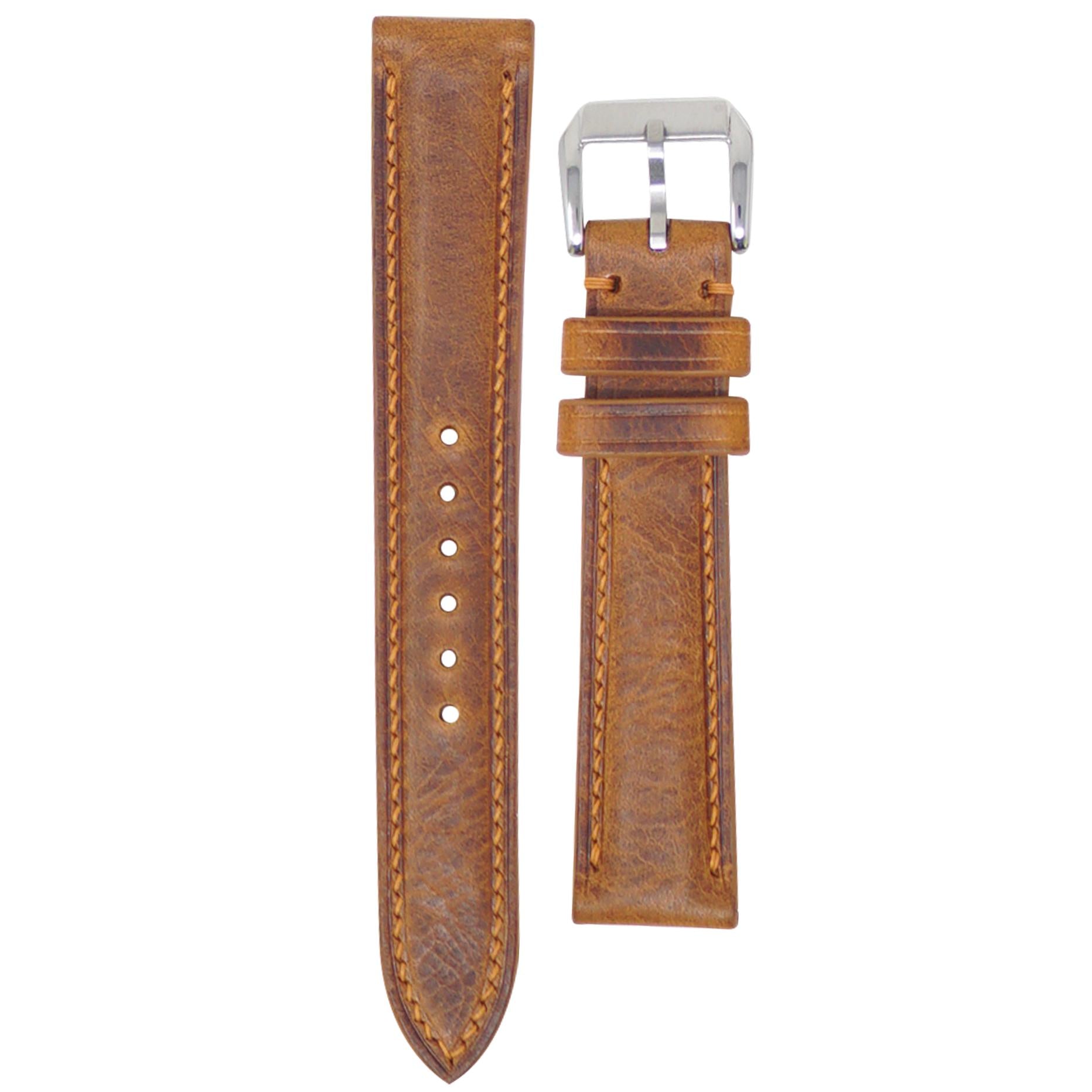 Cognac Badalassi Wax leather watch strap with light brown stitching and a silver buckle, flat lay.
