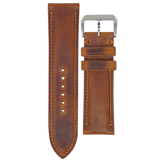 Cognac Badalassi Wax leather watch strap with matching stitching and silver buckle, flat lay.