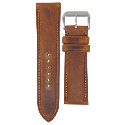 Cognac Badalassi Wax leather watch strap, 24mm, with light brown stitching and a silver buckle, flat lay.