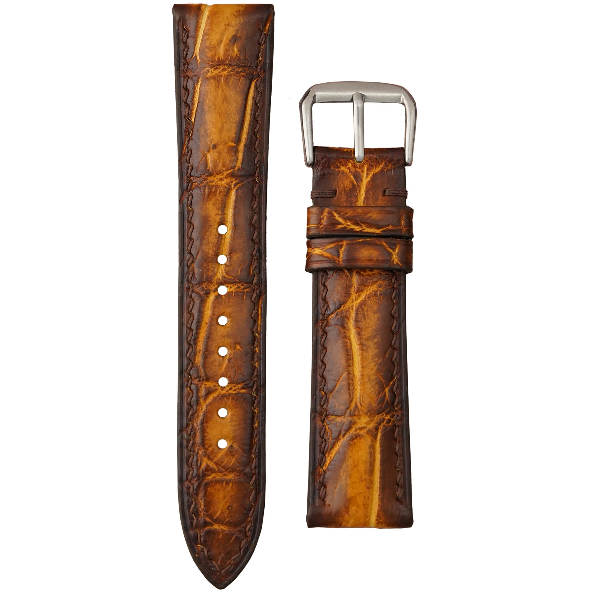Burnt chestnut crocodile leather watch strap with matching stitching and a silver buckle, flat lay.