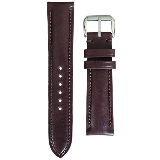 Bordeaux Buttero leather watch strap with matching stitching and silver buckle, flat lay.