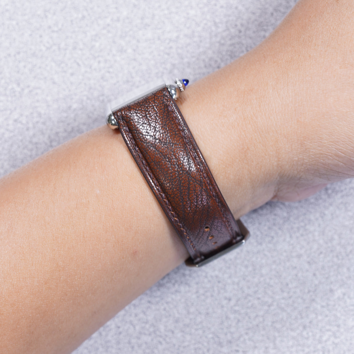 Cartier Tank Must with a patchouli brown Alran Patnat goat leather strap, strap detail on the wrist