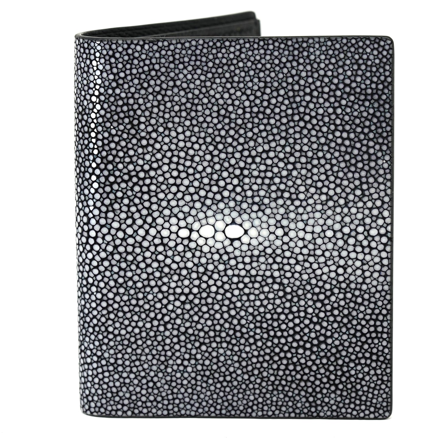 Black stingray leather wallet with textured surface and central white "eye" pattern, flat lay.