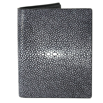Black stingray leather wallet with textured surface and central white "eye" pattern, flat lay.