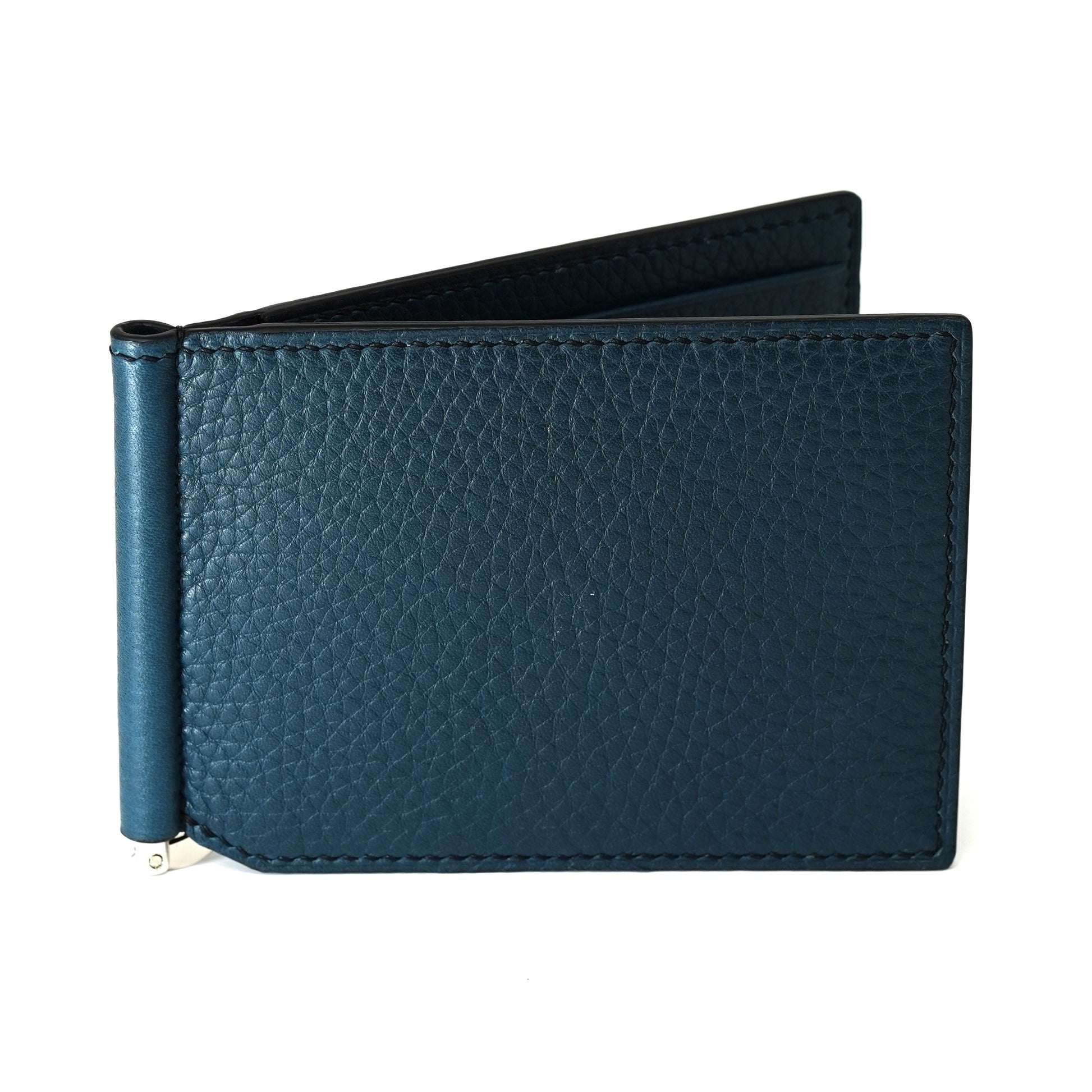 Mallard blue pebbled leather money clip with a silver metal clip, slightly open, flat lay.