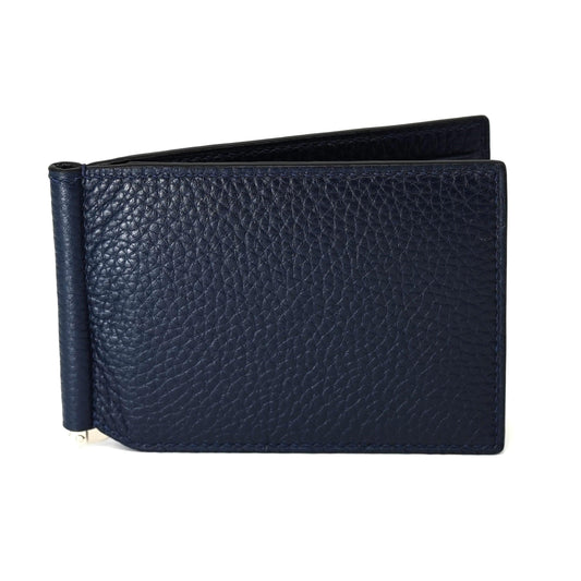 Navy pebbled leather money clip wallet, open slightly, with a silver clip visible on the left side.