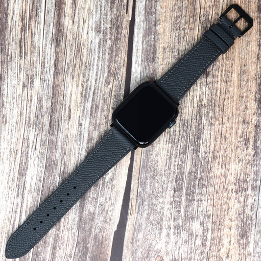 Gris Meyer Epsom leather watch strap with black hardware, flat lay.