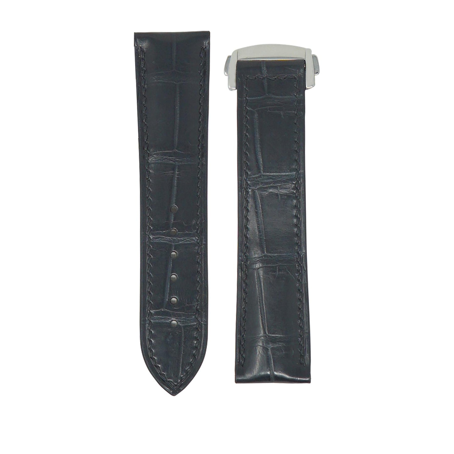 Flat lay of a dark grey crocodile leather watch strap with matching stitching and a silver deployment clasp.
