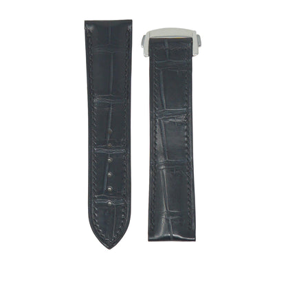 Flat lay of a dark grey crocodile leather watch strap with matching stitching and a silver deployment clasp.