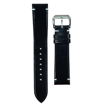 Black Shell Cordovan leather watch strap with white stitching and silver buckle, flat lay.