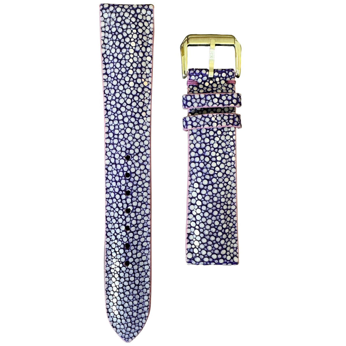 Purple stingray leather watch strap with white pearl-like texture and a gold buckle, flat lay.
