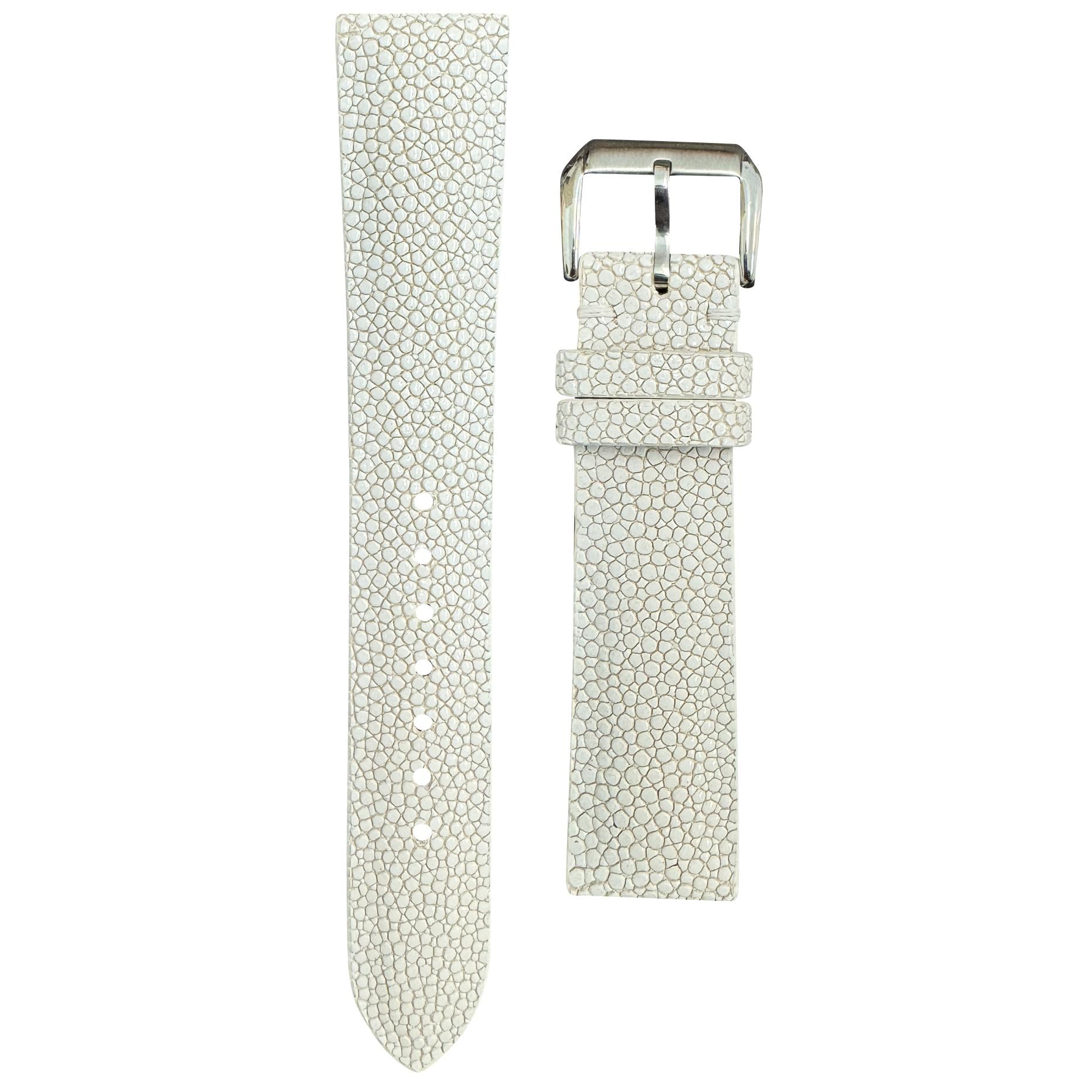 White stingray leather watch strap with silver buckle, flat lay.
