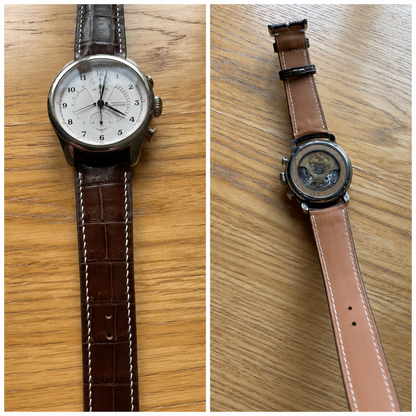 Brown crocodile leather watch strap with white stitching on a white-dial chronograph, shown from the front and underside.