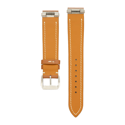 Underside of the brown Swift Cartier Roadster strap, showing the steel clip-in inserts at both case ends and the tan calfskin lining, flat lay.