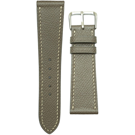 Gray Epsom leather watch strap with white stitching and silver buckle, flat lay.