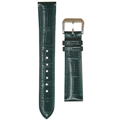 Dark green crocodile leather watch strap with matching stitching and a silver buckle, flat lay.