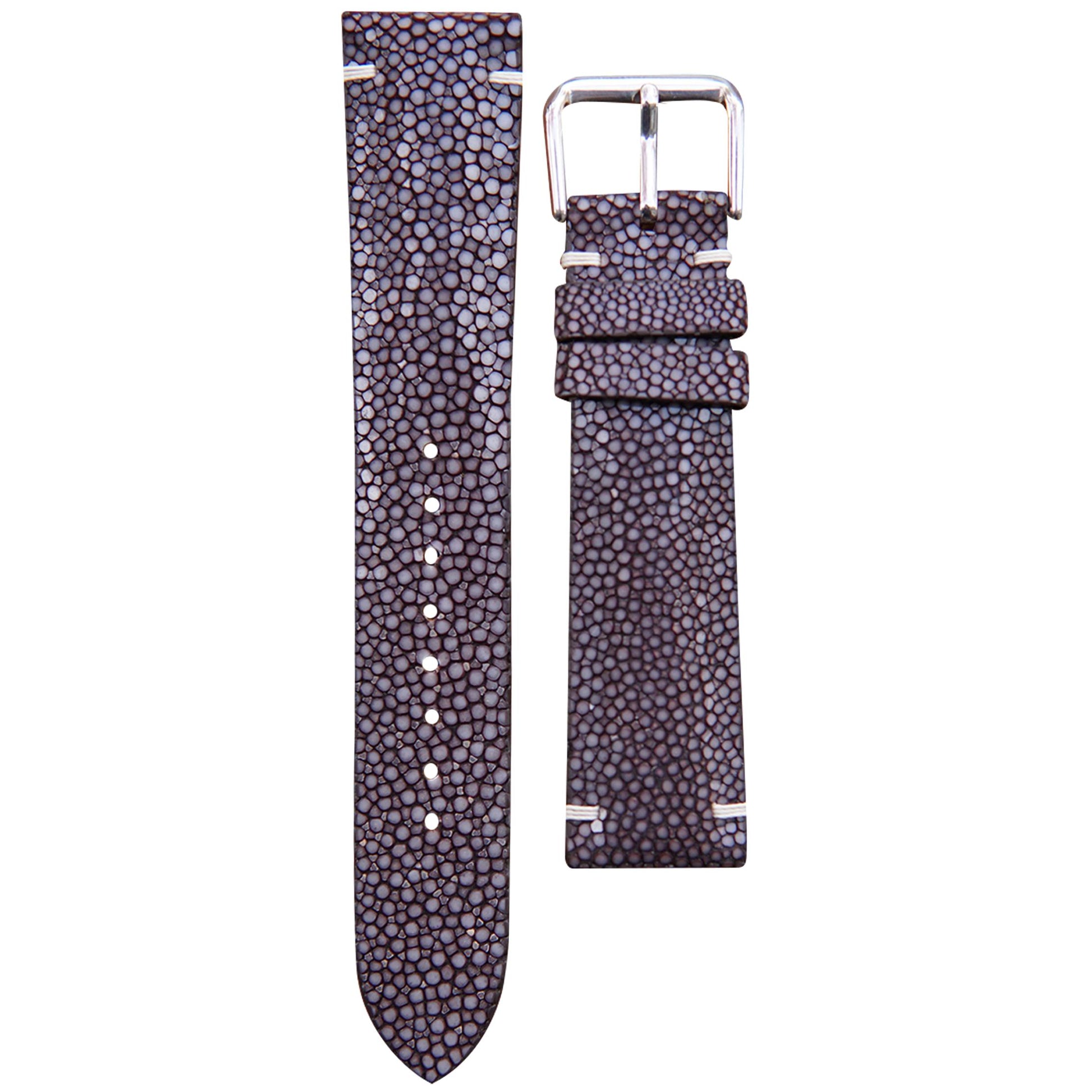 Brown stingray leather watch strap with white stitching and silver buckle, flat lay.