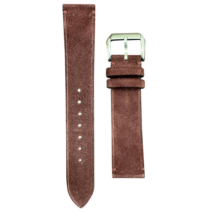 Maroon suede leather watch strap with silver buckle, flat lay.