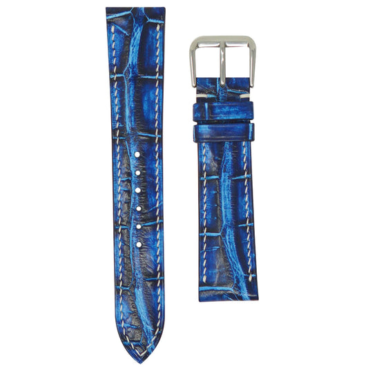 Electric blue crocodile leather watch strap with white stitching and silver buckle, flat lay.