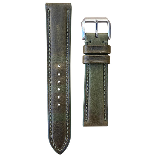 Olive green Badalassi Wax leather watch strap with light stitching and silver buckle, flat lay.