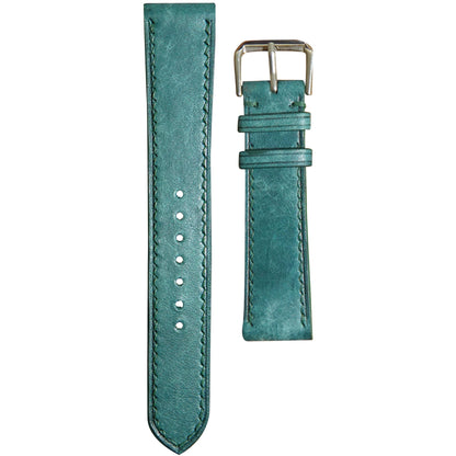 Turquoise Maya leather watch strap with matching stitching and a silver buckle, flat lay.