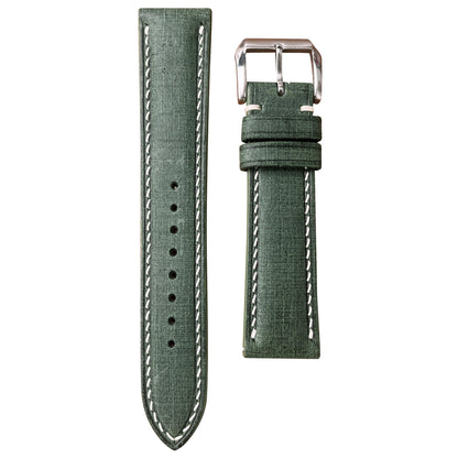 Verde Babele linen leather watch strap with white stitching and a polished silver buckle, flat lay.