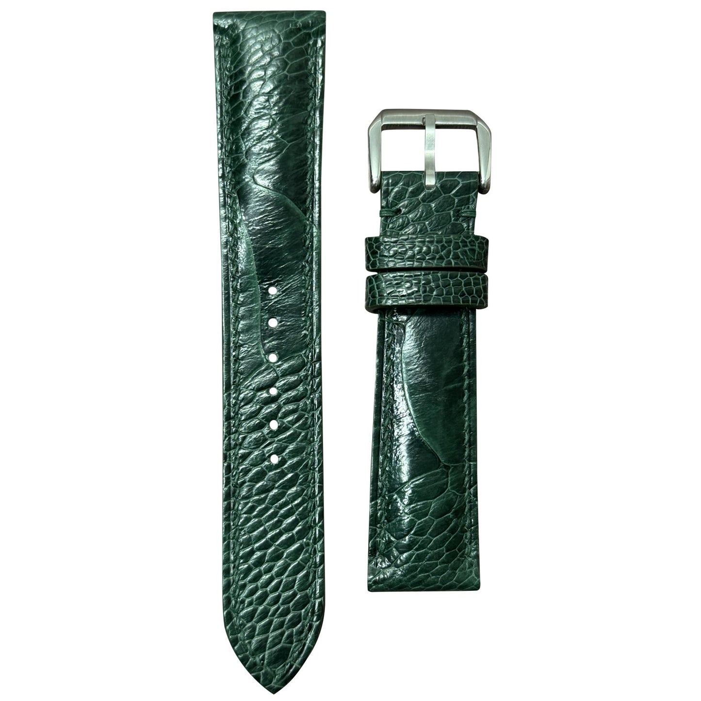 Green ostrich leg leather watch strap with silver buckle, flat lay.