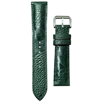 Green ostrich leg leather watch strap with silver buckle, flat lay.