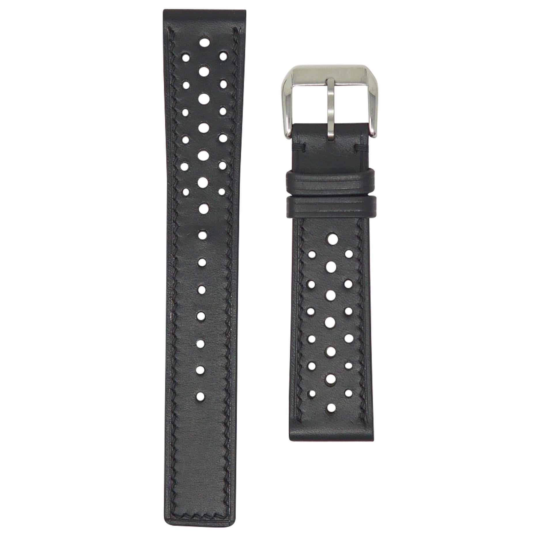 Black perforated racing leather watch strap with silver buckle, flat lay.