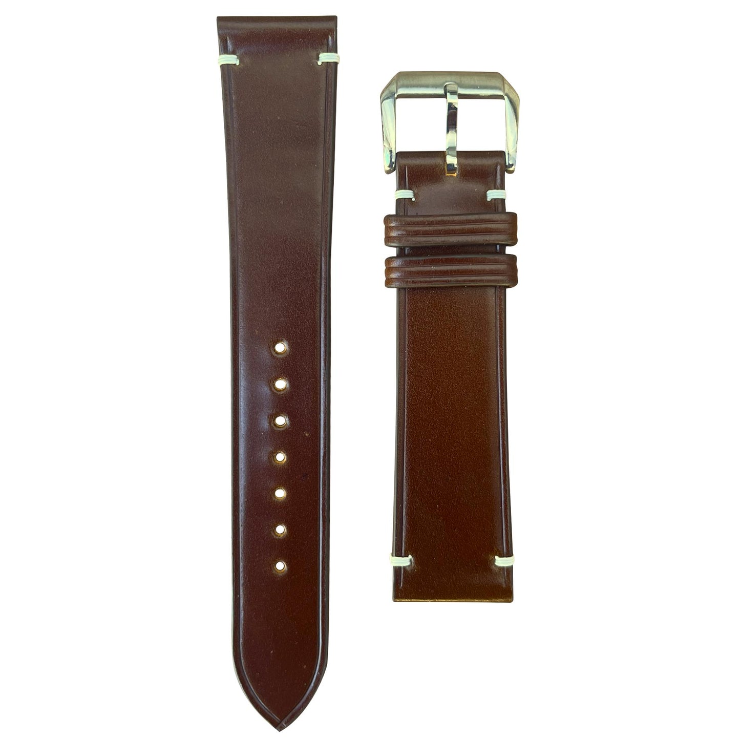 Cognac Shell Cordovan leather watch strap with white stitching and silver buckle, flat lay.