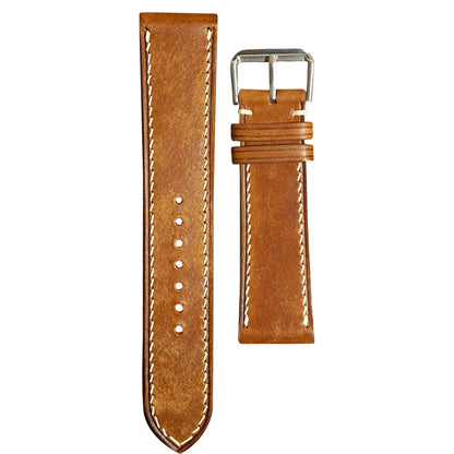 Whisky Maya leather watch strap with white stitching and silver buckle, flat lay.