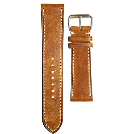 Whisky Maya leather watch strap with white stitching and silver buckle, flat lay.