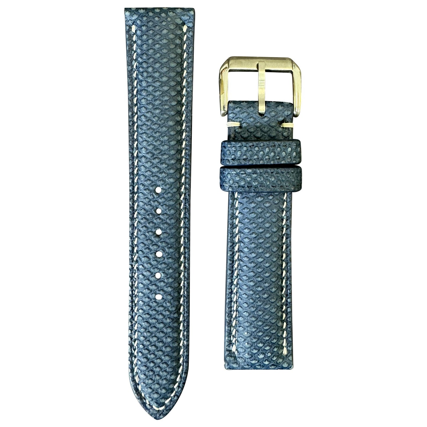 Navy Karung snake skin leather watch strap with white stitching and gold buckle, flat lay.