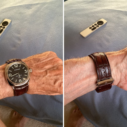 Front and reverse customer views of an oxblood brown crocodile leather watch strap on a Panerai watch, including deployant buckle detail.