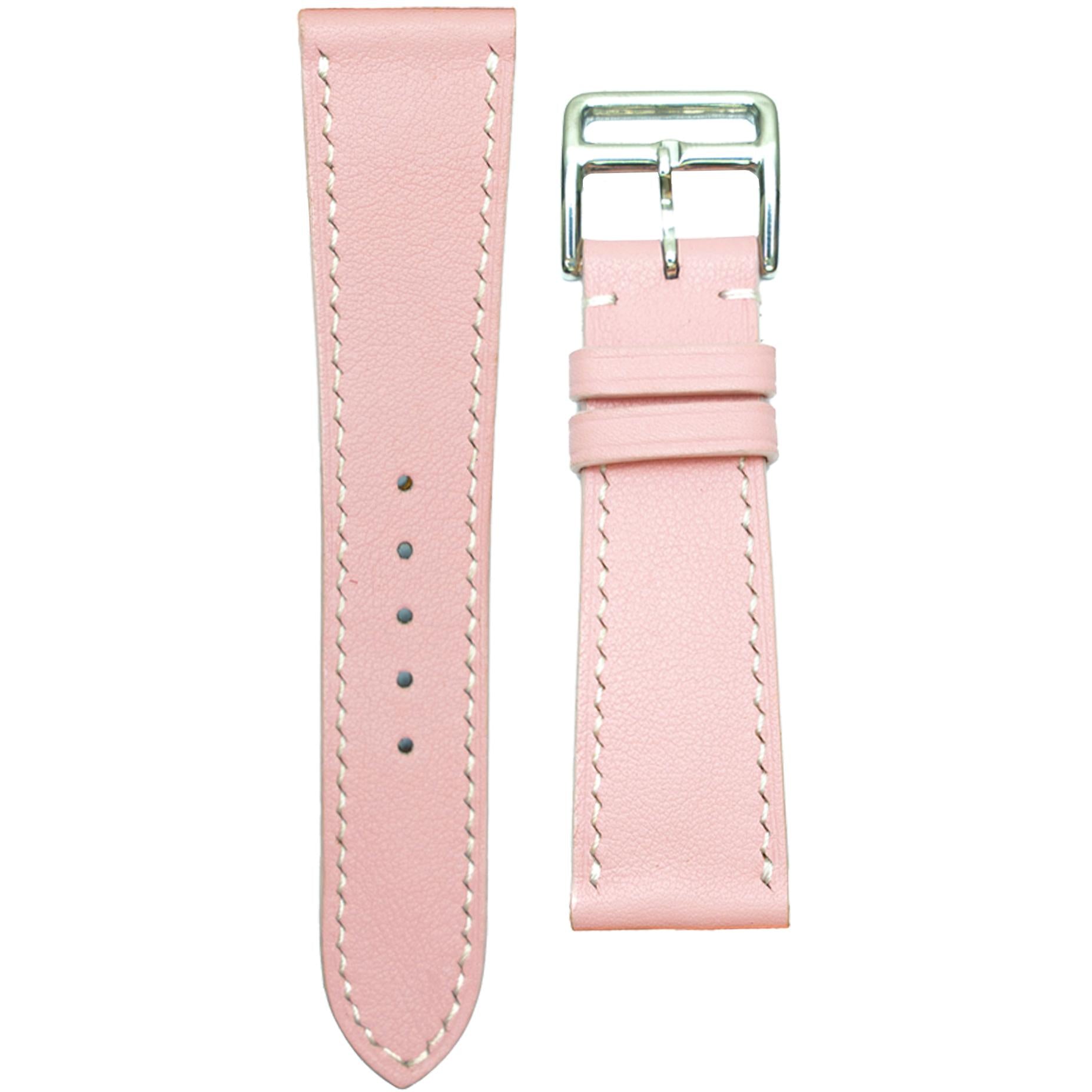 Pink Swift leather watch strap with white stitching and silver buckle, flat lay.