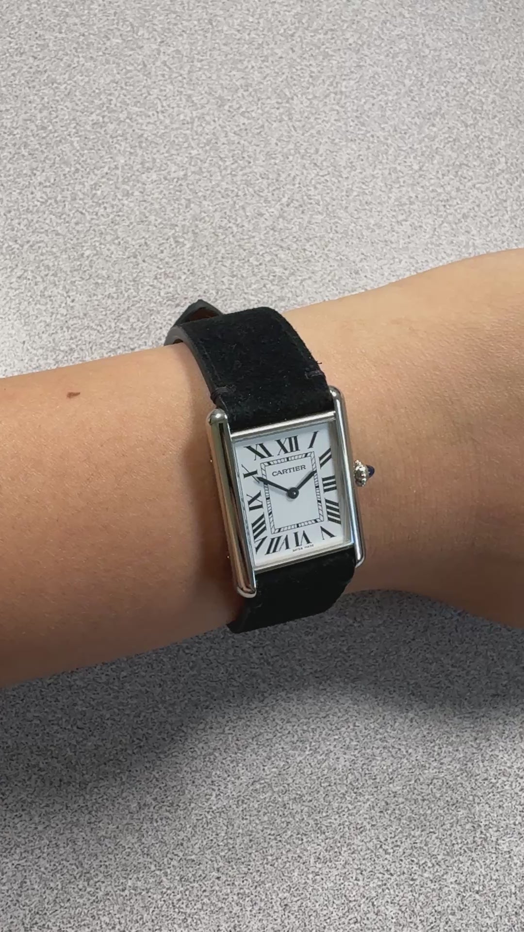 Black suede leather strap for Cartier Tank Must, on the wrist