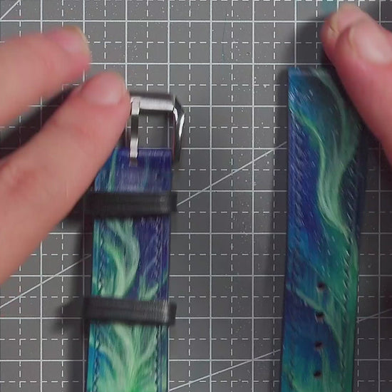 Video of the Aurora Reflections hand-carved and hand-painted leather watch strap.