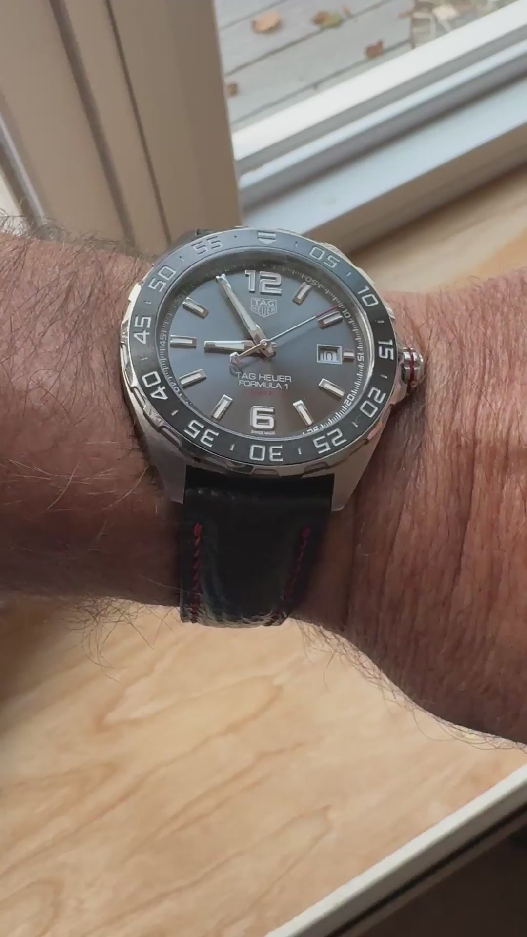 Customer video showing a black shark skin watch strap with red stitching fitted to a TAG Heuer watch.
