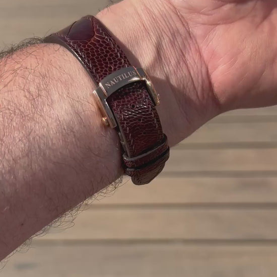 Customer video showing a burgundy custom centre-notched leather watch strap fitted to a Nautilus-style watch.