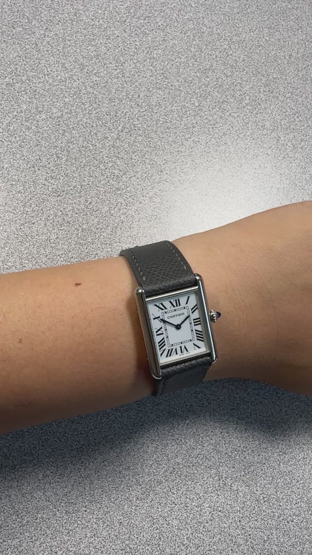 Gris Meyer grey Epsom leather strap for Cartier Tank Must, on the wrist