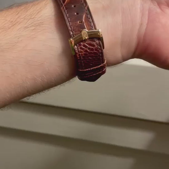 Customer video showing a dark brown ostrich leg leather watch strap fitted to a floral-dial watch from front, side and buckle angles.