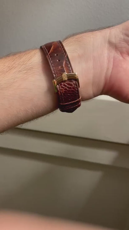 Customer video showing a dark brown ostrich leg leather watch strap fitted to a floral-dial watch from front, side and buckle angles.