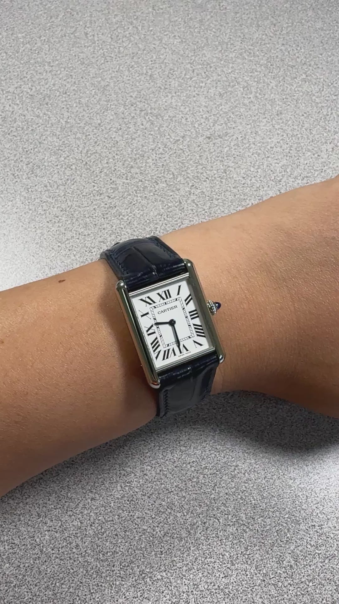 Dark blue crocodile leather strap for Cartier Tank Must, on the wrist
