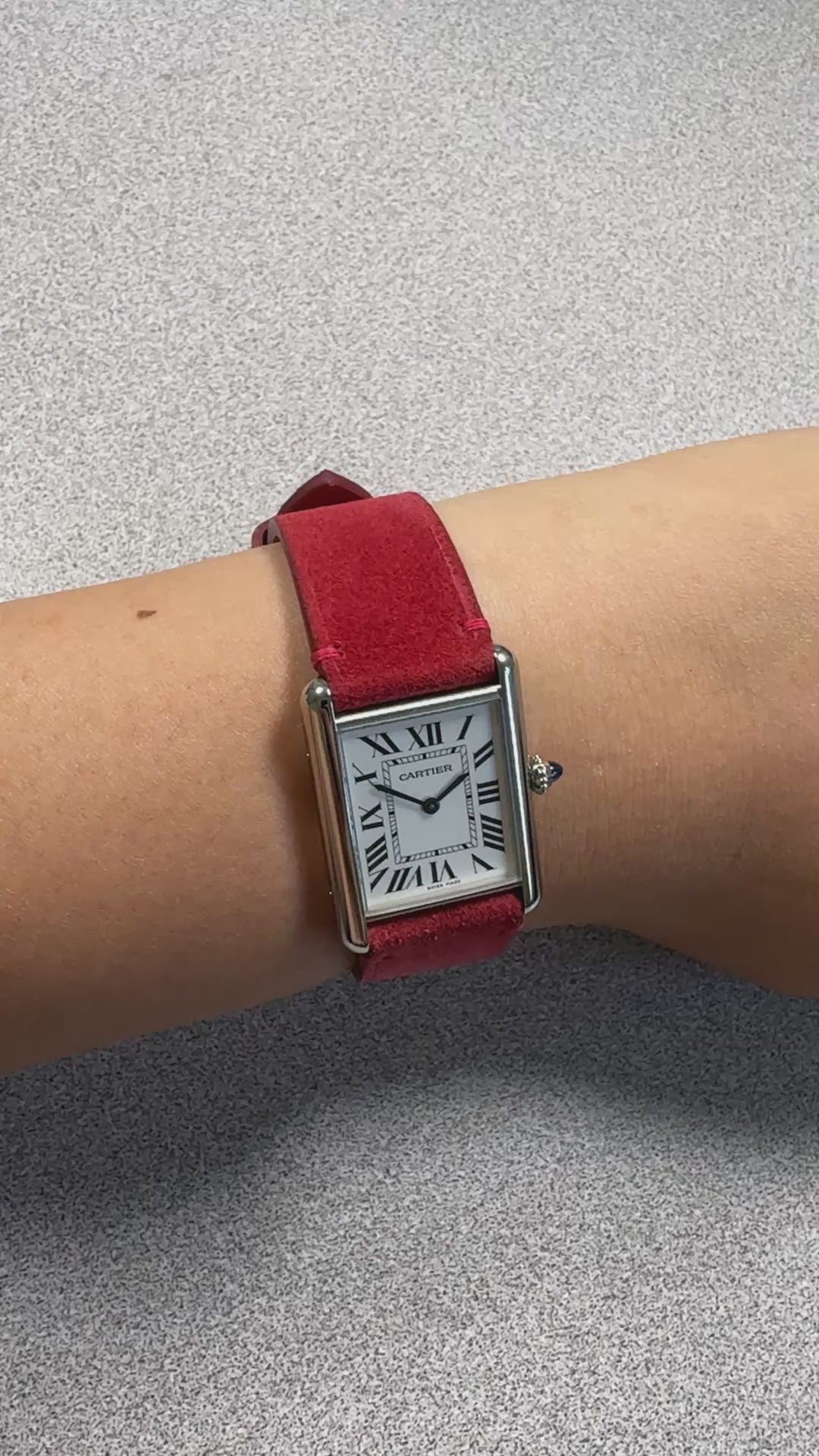 Red suede leather strap for Cartier Tank Must, on the wrist