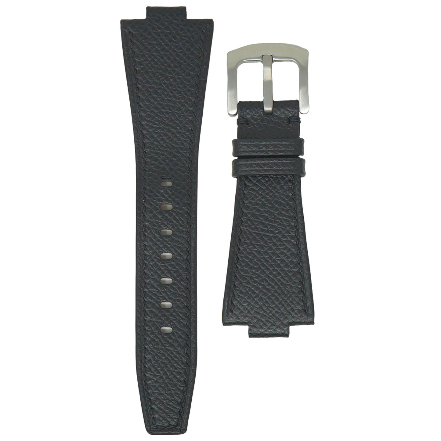 Black textured leather watch strap with silver buckle, flat lay.