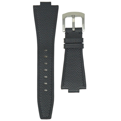 Black textured leather watch strap with silver buckle, flat lay.