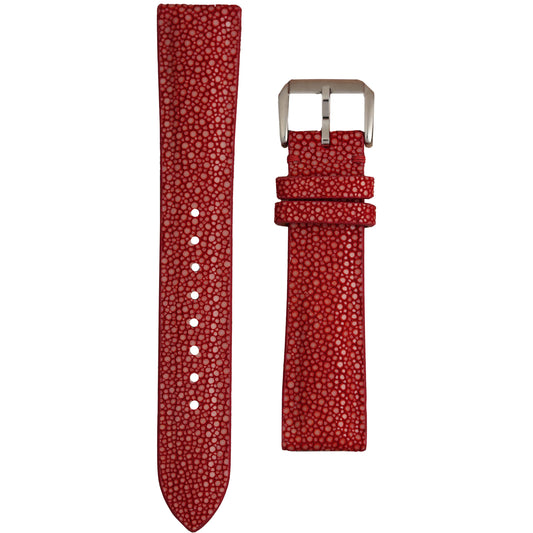 Crimson red stingray leather watch strap with white stitching and a silver buckle, flat lay.